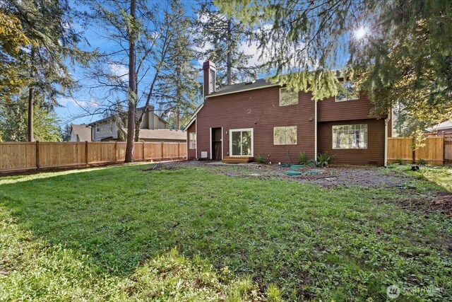 back of property featuring a chimney and entry steps