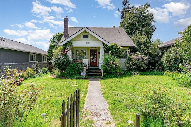 bungalow-style home featuring a chimney and a shingled roof