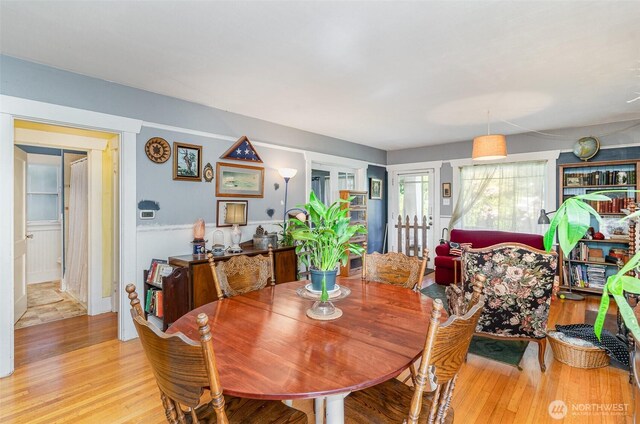 dining area featuring light wood finished floors