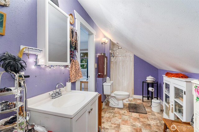 full bath with a textured ceiling, toilet, a shower with shower curtain, vaulted ceiling, and vanity
