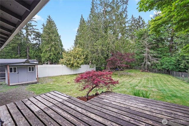 deck with an outbuilding and a shed