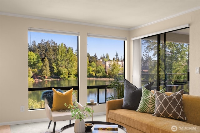 sunroom featuring crown molding, a water view, and baseboards