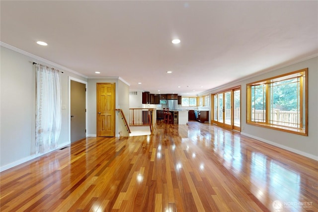 2022 Scarpelli Dr, Walla Walla, WA 99362 - unfurnished living room with crown molding, light wood-style flooring, recessed lighting, and baseboards