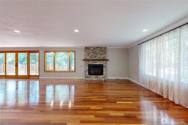 2022 Scarpelli Dr, Walla Walla, WA 99362 - unfurnished living room with crown molding, light wood-type flooring, baseboards, a fireplace, and recessed lighting