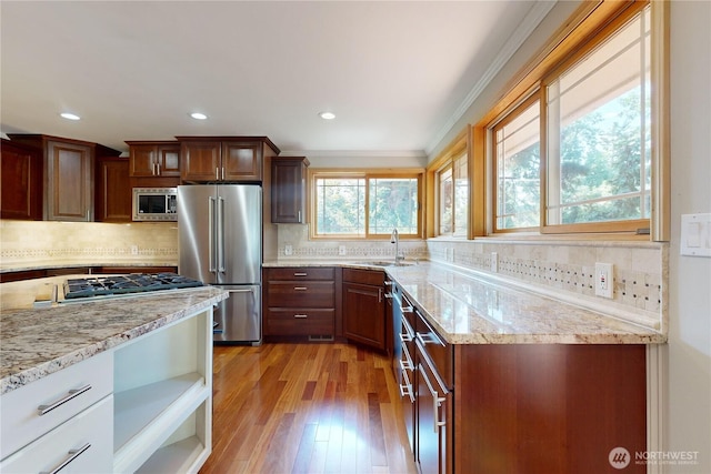 2022 Scarpelli Dr, Walla Walla, WA 99362 - kitchen featuring appliances with stainless steel finishes, a sink, backsplash, light wood-style floors, and recessed lighting