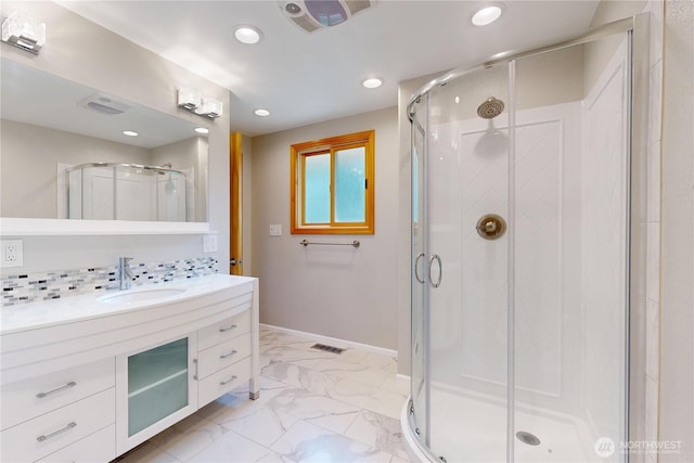 2022 Scarpelli Dr, Walla Walla, WA 99362 - full bathroom with marble finish floors, recessed lighting, a stall shower, vanity, and baseboards