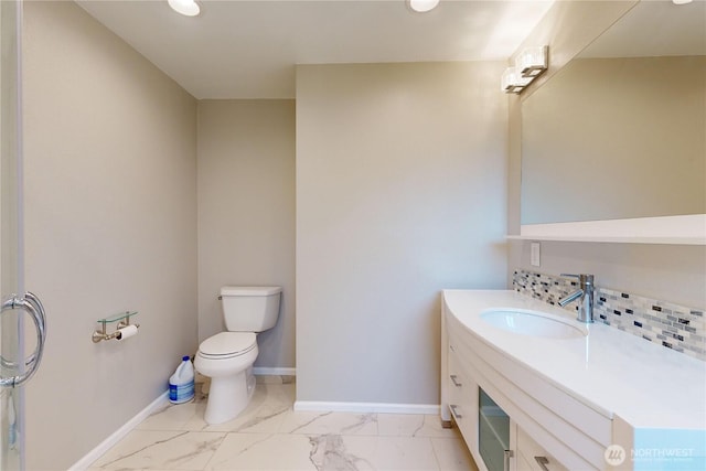 2022 Scarpelli Dr, Walla Walla, WA 99362 - bathroom with marble look tile flooring, baseboards, toilet, vanity, and recessed lighting