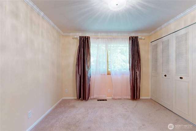 2022 Scarpelli Dr, Walla Walla, WA 99362 - unfurnished bedroom with carpet flooring, crown molding, baseboards, and a closet