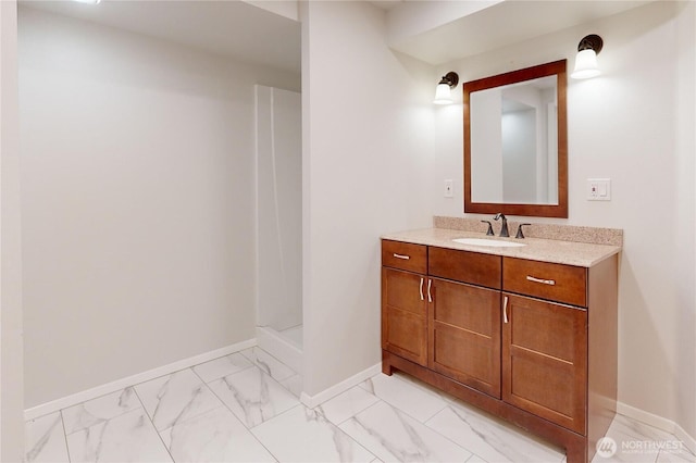 2022 Scarpelli Dr, Walla Walla, WA 99362 - bathroom with marble look tiles, vanity, baseboards, and a shower