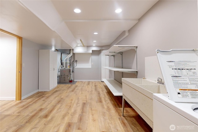 2022 Scarpelli Dr, Walla Walla, WA 99362 - laundry room with light wood-style floors, heating unit, baseboards, and recessed lighting