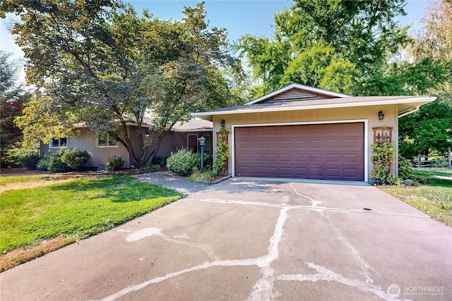 2022 Scarpelli Dr, Walla Walla, WA 99362 - ranch-style home with concrete driveway, a garage, and a front lawn