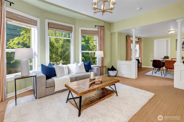 1109 30th Ave, Seattle, WA 98122 - living room featuring ornate columns, a chandelier, and light carpet