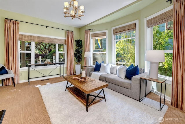 1109 30th Ave, Seattle, WA 98122 - living room with carpet floors, a chandelier, and baseboards