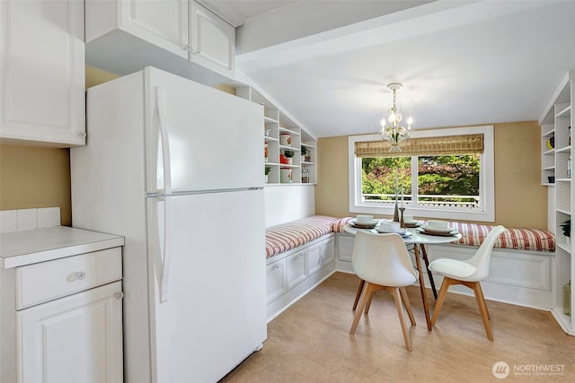 1109 30th Ave, Seattle, WA 98122 - kitchen featuring freestanding refrigerator, a chandelier, white cabinets, light countertops, and open shelves