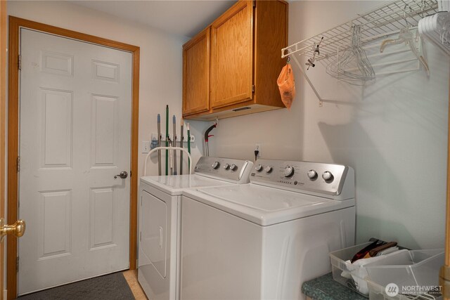 laundry room featuring cabinet space and washing machine and dryer