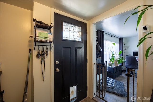 foyer featuring wood finished floors