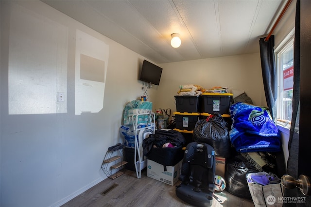 bedroom with wood finished floors