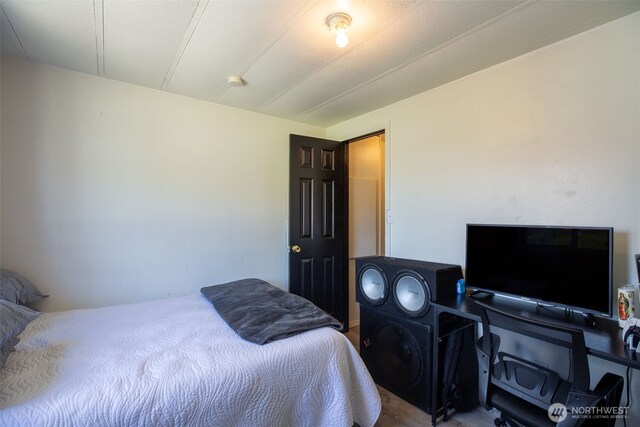 bedroom with wood finished floors