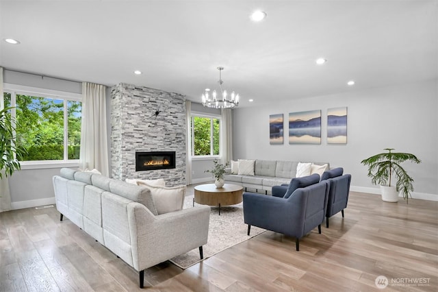 5010 NW Dr, Bellingham, WA 98226 - living room with baseboards, light wood-style flooring, a fireplace, a chandelier, and recessed lighting