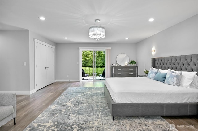 5010 NW Dr, Bellingham, WA 98226 - bedroom featuring access to exterior, wood finished floors, a chandelier, baseboards, and recessed lighting