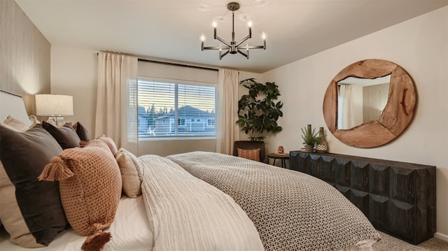 bedroom featuring carpet flooring and an inviting chandelier
