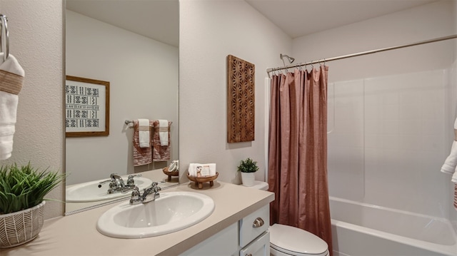 full bathroom featuring toilet, vanity, and shower / tub combo