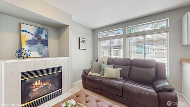12331 NE 101st Ln, Kirkland, WA 98033 - living room featuring a tile fireplace and baseboards