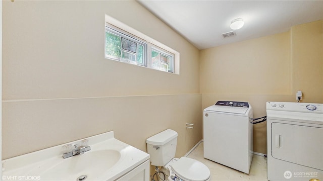 12331 NE 101st Ln, Kirkland, WA 98033 - bathroom featuring independent washer and dryer, toilet, and vanity