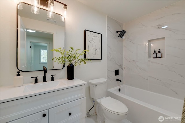 bathroom with toilet, vanity, and tub / shower combination