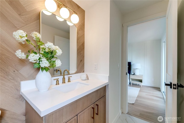 bathroom with vanity and baseboards