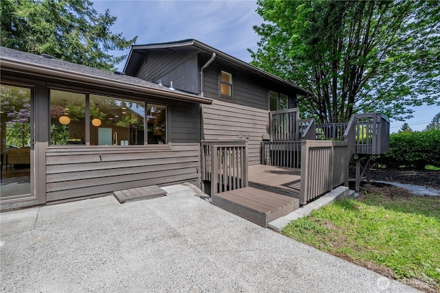 rear view of house with a deck
