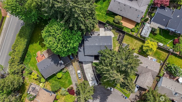aerial view of property and surrounding area with nearby suburban area