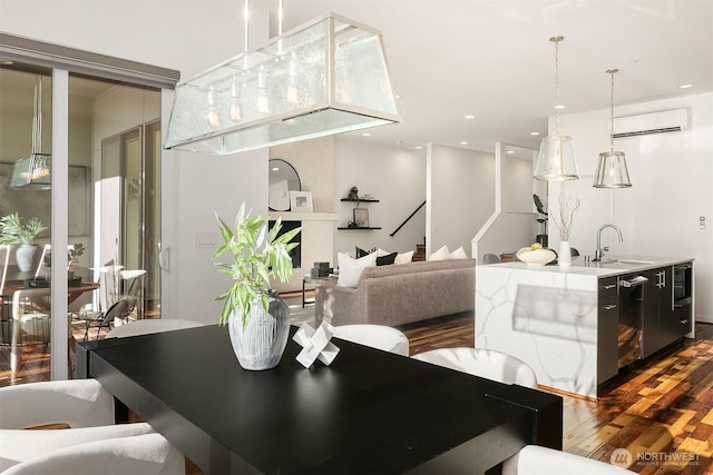 dining area featuring recessed lighting, dark wood finished floors, stairway, and an AC wall unit