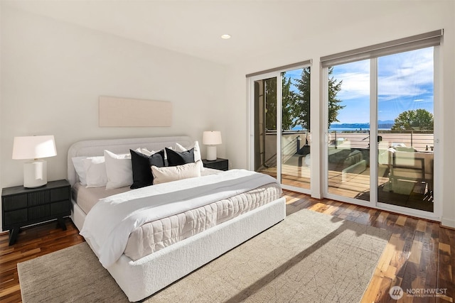 bedroom with wood finished floors, recessed lighting, and access to exterior