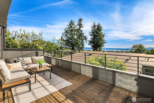 wooden terrace with outdoor lounge area