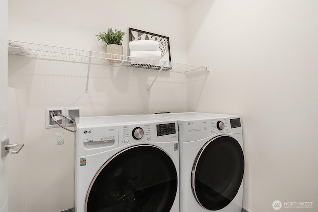 washroom with washer and dryer and laundry area