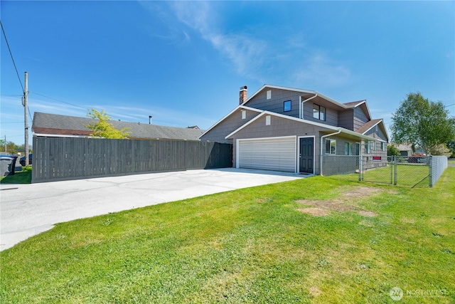 view of front of home featuring driveway, a chimney, a gate, and an attached garage