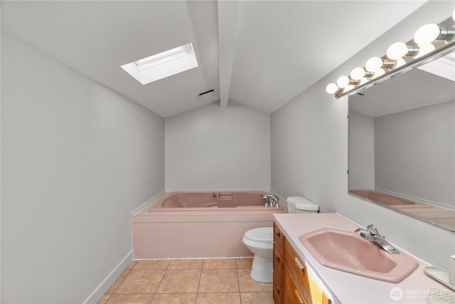 bathroom with a skylight, tile patterned flooring, a bath, toilet, and vanity