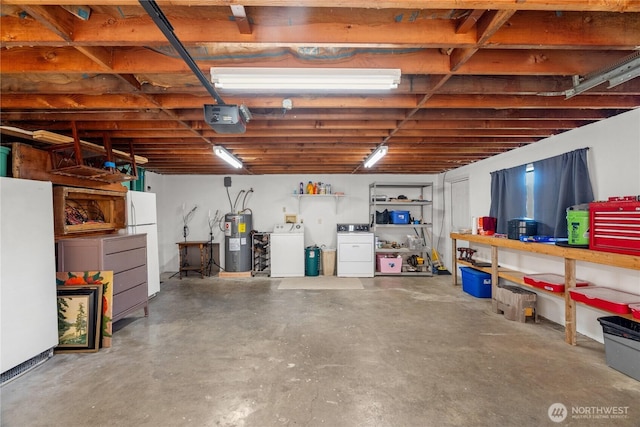 garage featuring water heater, independent washer and dryer, a garage door opener, and freestanding refrigerator
