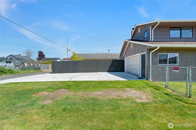view of home's exterior featuring a garage, driveway, and a chimney