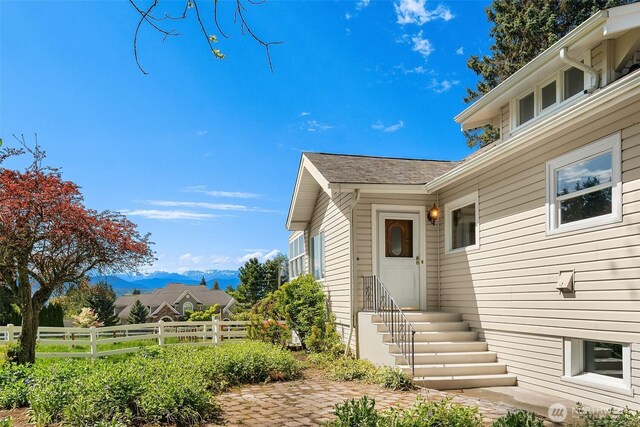 25443 Pioneer Way NW, Poulsbo, WA 98370 - property entrance with fence and a mountain view