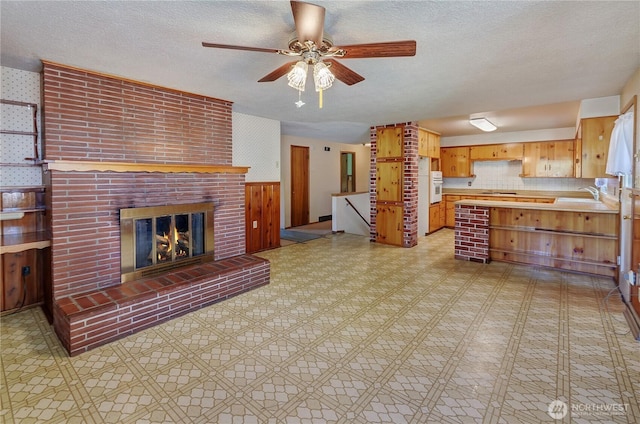 2734 Sunset Dr W, University Place, WA 98466 - interior space featuring light floors, a textured ceiling, ceiling fan, a sink, and light countertops