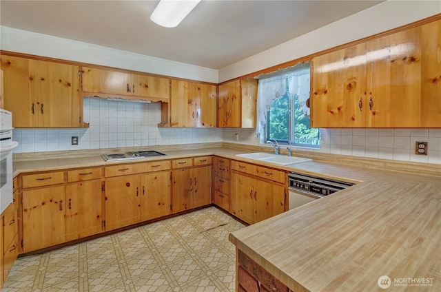2734 Sunset Dr W, University Place, WA 98466 - kitchen featuring white dishwasher, light countertops, a sink, and cooktop