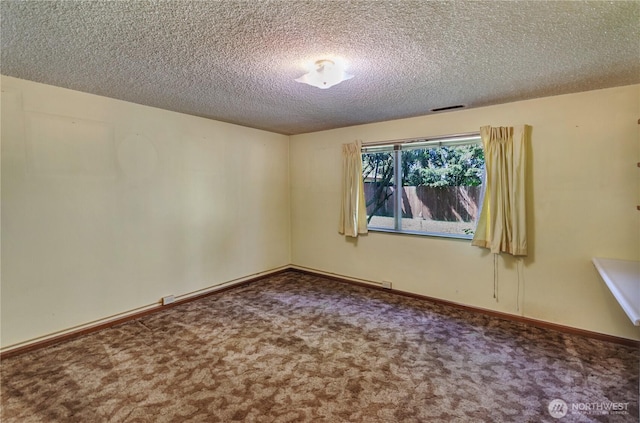 2734 Sunset Dr W, University Place, WA 98466 - spare room featuring carpet, a textured ceiling, and visible vents