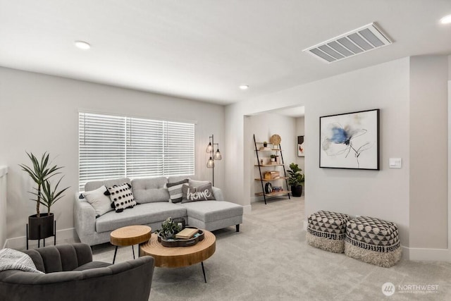 living room with baseboards, recessed lighting, light carpet, and visible vents