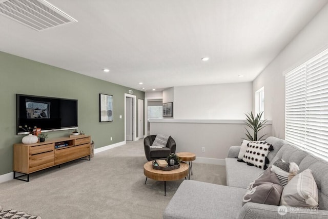 living room with baseboards, recessed lighting, visible vents, and carpet floors