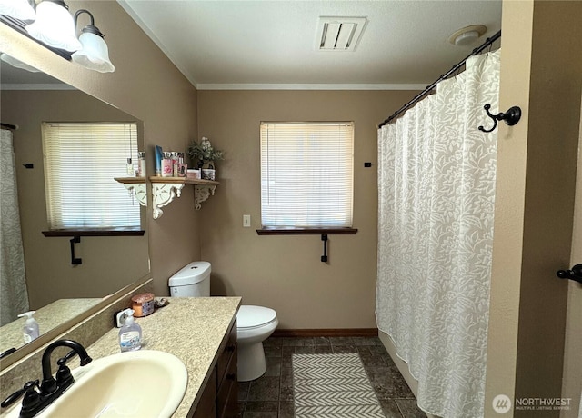 70 Cedar Hill Ln, Sequim, WA 98382 - full bathroom featuring toilet, plenty of natural light, vanity, crown molding, and baseboards