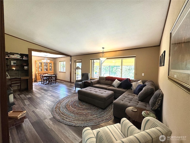 70 Cedar Hill Ln, Sequim, WA 98382 - living room with wood finished floors, a textured ceiling, a chandelier, vaulted ceiling, and ornamental molding