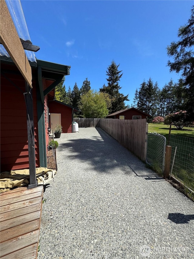 70 Cedar Hill Ln, Sequim, WA 98382 - view of yard with fence, driveway, and a gate
