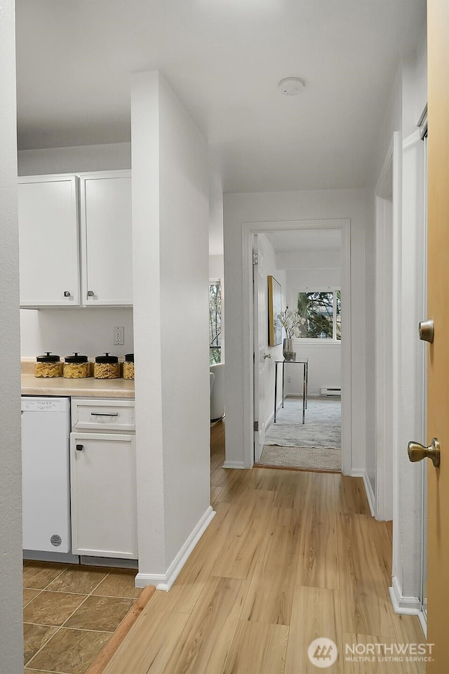 19428 Aurora Ave N Unit 433, Shoreline, WA 98133 - hall featuring baseboards and light wood-style flooring